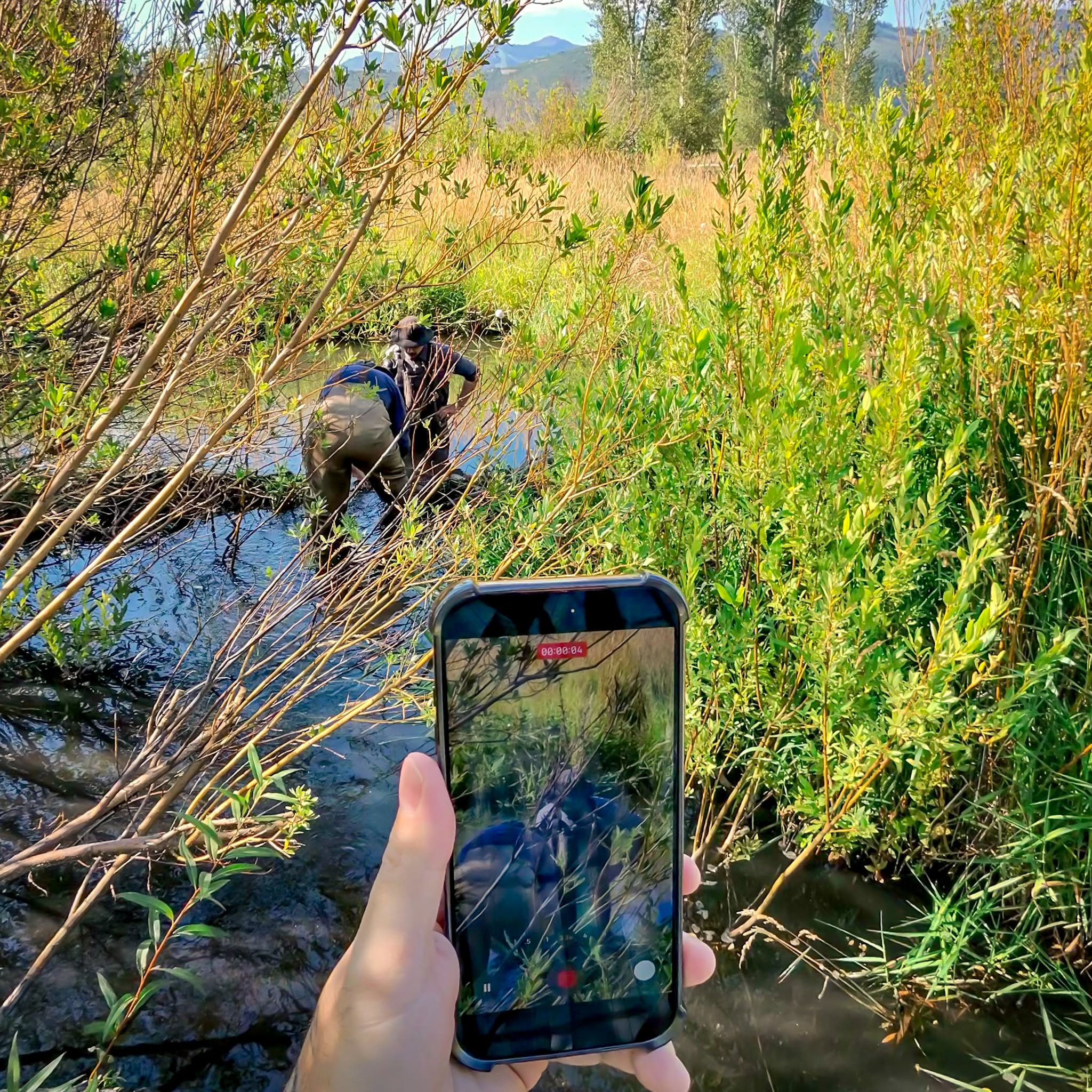 Filming client work in a Utah creek